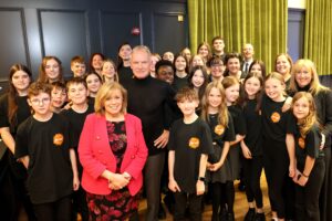 Musician Sting with members of North Tyneside Youth Choir and NTMEH staff