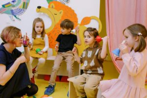 Early Years children exploring music making through chime bells